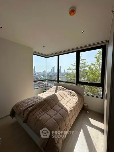 Modern bedroom with stunning city view and large windows