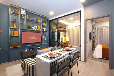 Modern open-plan living and dining area with stylish decor and cozy ambiance.