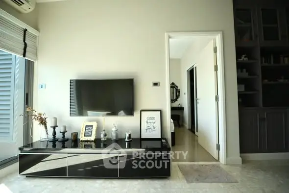 Modern living room with sleek TV setup and stylish decor