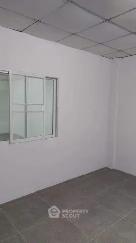 Minimalist room with tiled floor and sliding window, ideal for customization.