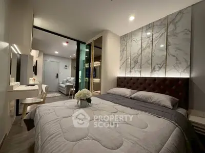 Luxurious bedroom with elegant decor and modern furnishings in a stylish apartment.
