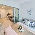 Modern open-layout living room with stylish decor and sliding glass doors