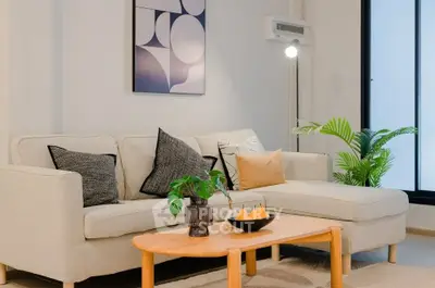 Modern living room with stylish decor and cozy seating area.