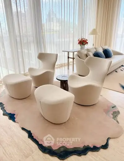 Luxurious modern living room with designer chairs and elegant decor