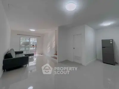 Spacious modern living room with sleek design and natural light