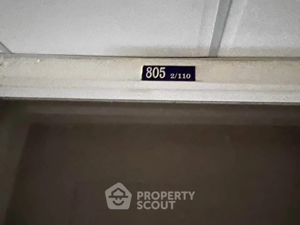 Apartment door with unit number 805, indicating a residential property entryway.