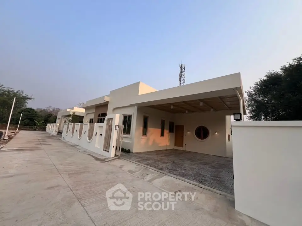 Modern single-story home with unique architectural design and spacious driveway, perfect for contemporary living.