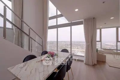 Luxurious high-rise apartment with stunning city view and elegant dining area.