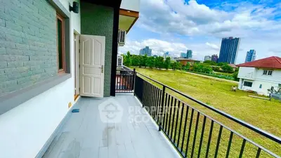 Spacious balcony with city view in modern apartment
