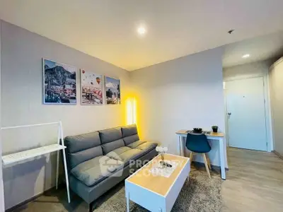 Modern living room with stylish decor and cozy seating area in a contemporary apartment.