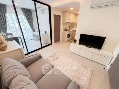 Modern living room with open kitchen and balcony view in stylish apartment
