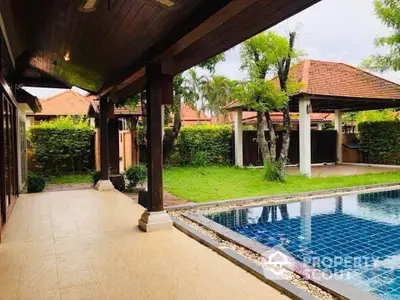 Luxurious villa with private pool and lush garden, perfect for relaxation and entertainment.