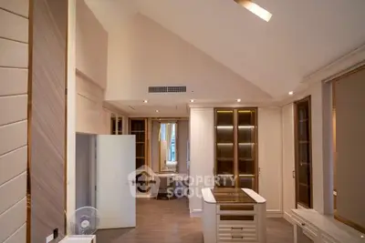 Luxurious modern kitchen with high ceilings and elegant cabinetry