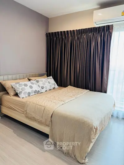 Cozy bedroom with elegant decor and natural light, featuring a comfortable bed and stylish curtains.
