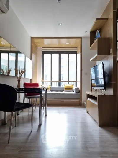 Modern living room with stylish decor and large window seating area