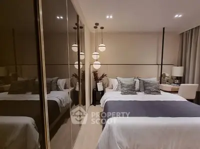 Modern bedroom with elegant lighting and mirrored wardrobe