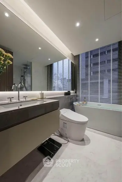 Luxurious modern bathroom with sleek fixtures and city view