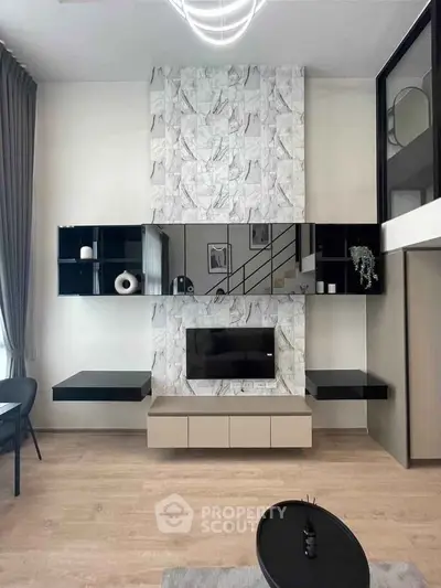 Modern living room with stylish marble accent wall and sleek black shelving