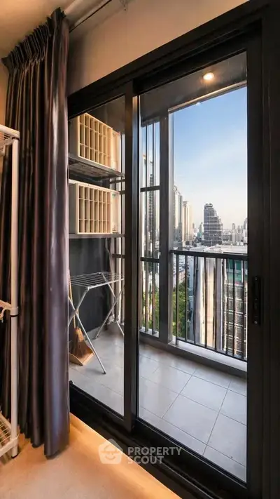 Modern apartment balcony with stunning city view and sliding glass doors