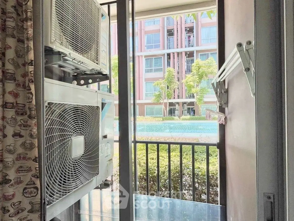 Charming apartment view with air conditioning units and lush greenery