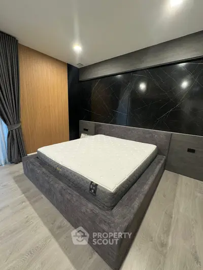 Modern bedroom with stylish bed frame and elegant decor