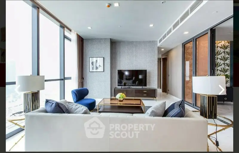 Luxurious modern living room with large windows and elegant decor