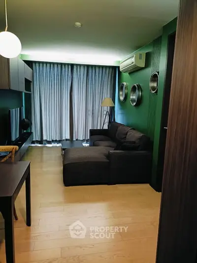 Spacious living room with modern decor and comfortable seating