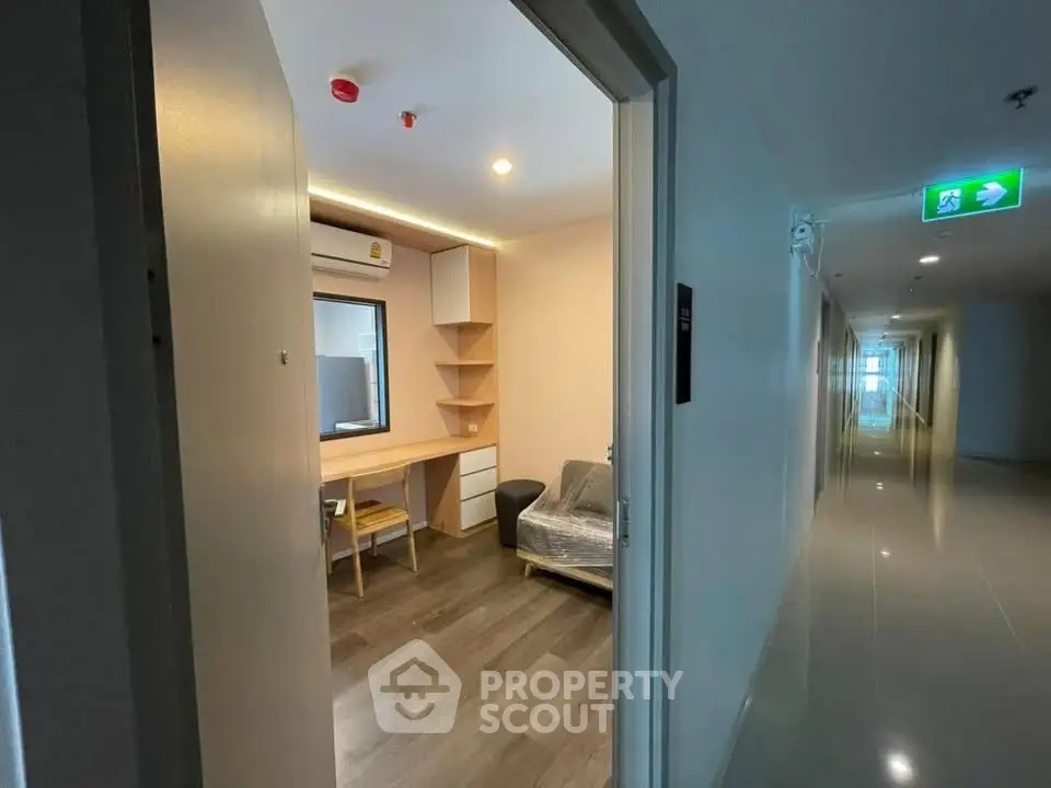 Modern apartment entrance with sleek hallway and cozy interior view