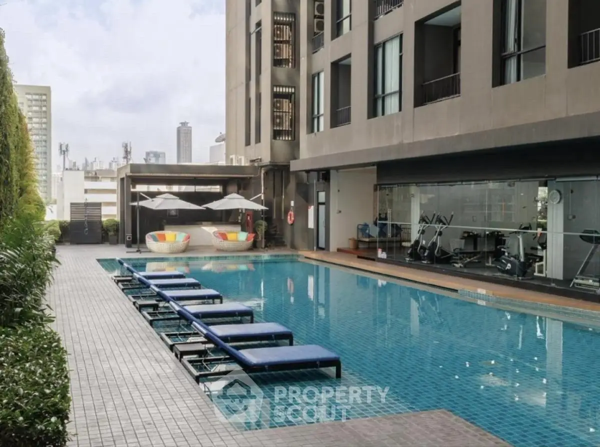 Luxurious apartment complex with pool and gym facilities in urban setting