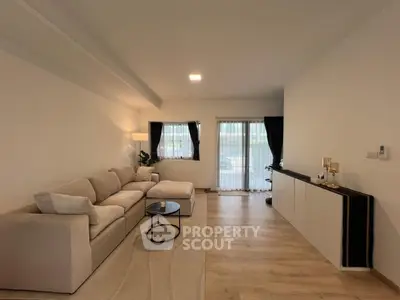 Spacious modern living room with elegant decor and natural light