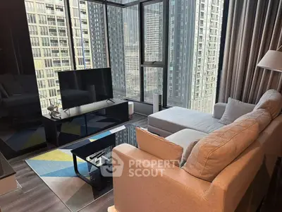 Luxurious living room with stunning city view and modern furnishings in high-rise apartment.