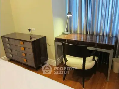 Elegant bedroom corner with stylish desk and chair, perfect for a cozy workspace.