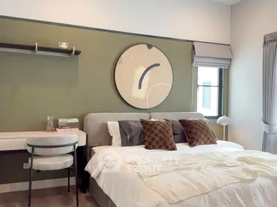 Modern bedroom with stylish decor and cozy ambiance, featuring a comfortable bed and elegant furnishings.