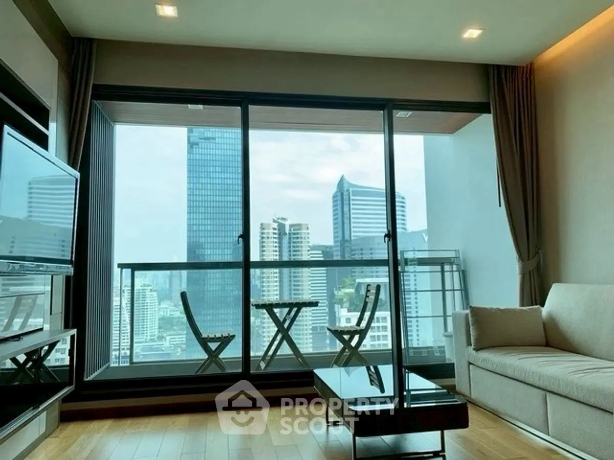 Modern living room with stunning city view and large balcony.