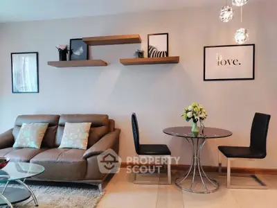 Stylish living room with modern decor, cozy sofa, elegant dining set, and chic wall art.