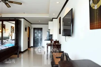 Modern apartment interior with sleek design and wall-mounted TV