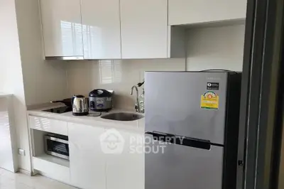 Modern kitchen with sleek appliances and minimalist design