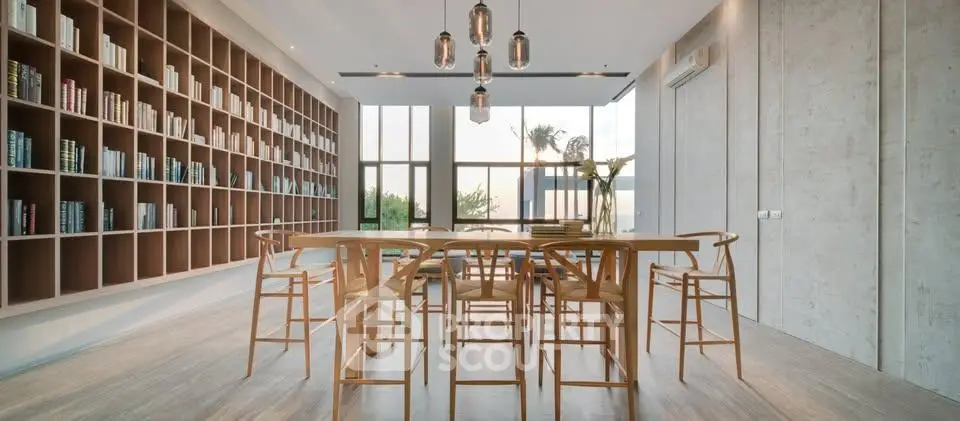 Modern library with floor-to-ceiling windows and stylish wooden furniture