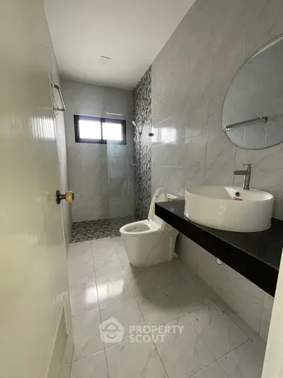 Modern bathroom with sleek fixtures and stylish tile design