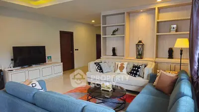 Spacious modern living room with elegant decor and cozy seating area.