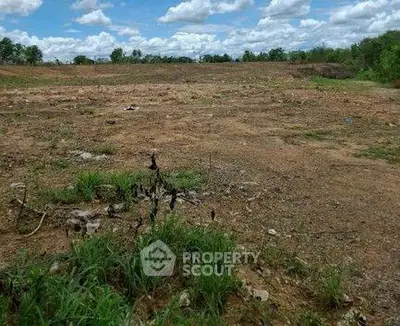 Expansive vacant land with clear skies, ideal for development opportunities.