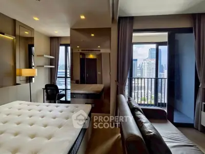 Luxurious bedroom with stunning city view and modern furnishings in high-rise apartment.