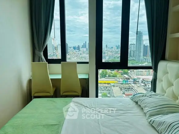 Stunning bedroom with panoramic city view and cozy decor