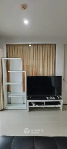 Modern living room with sleek TV stand and shelving unit, ideal for contemporary urban living.