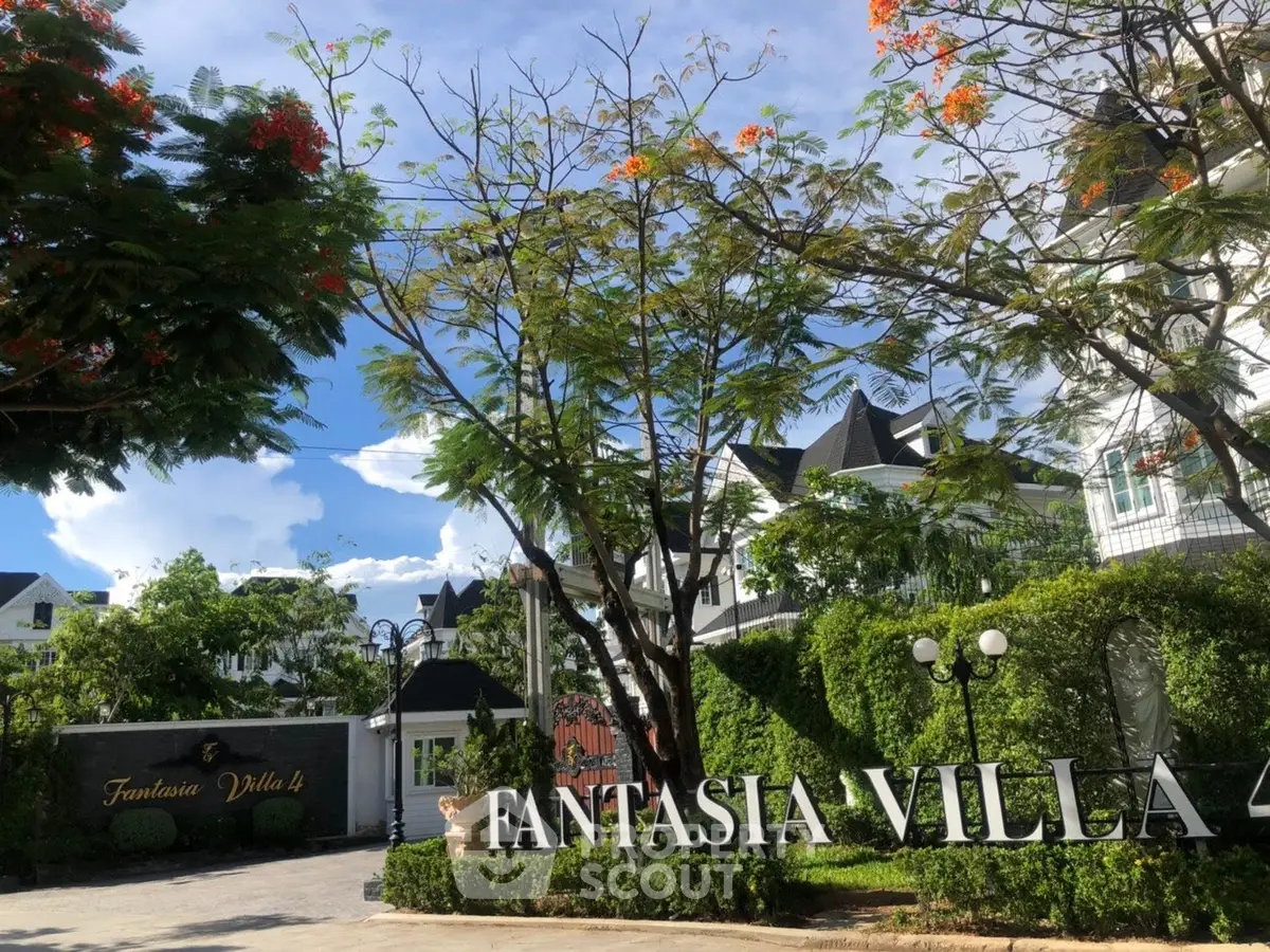 Luxurious Fantasia Villa 4 entrance with lush greenery and elegant architecture.