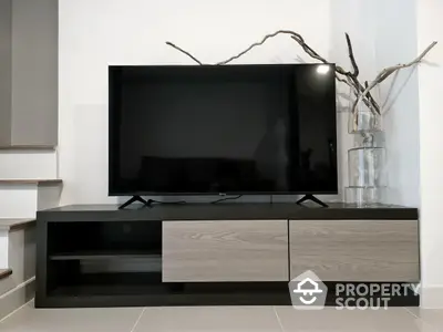 Modern living room with sleek TV stand and minimalist decor