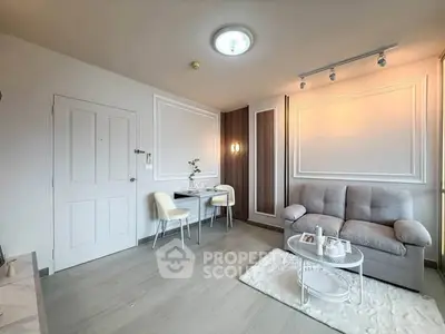 Modern living room with elegant decor, cozy sofa, and stylish dining area in a bright apartment.