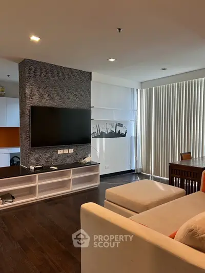 Modern living room with wall-mounted TV and stylish decor