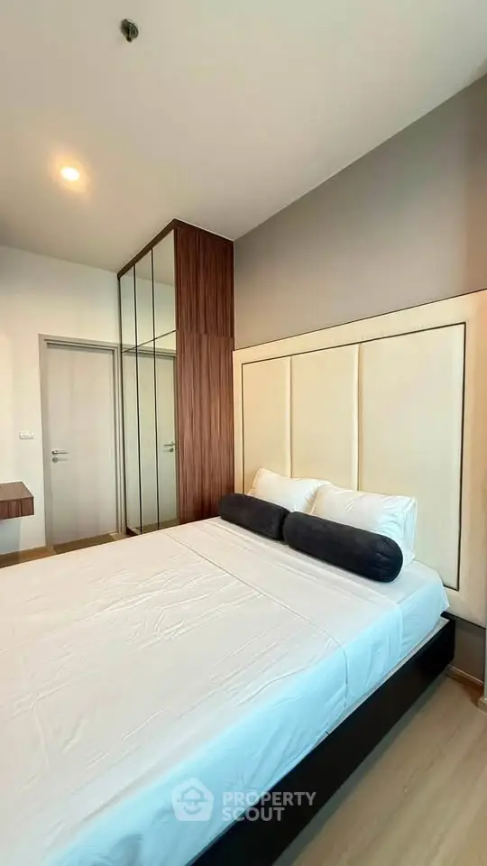 Modern bedroom with sleek design and ample natural light