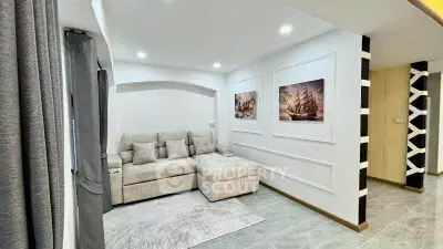 Modern living room with stylish decor and comfortable seating in a contemporary apartment.